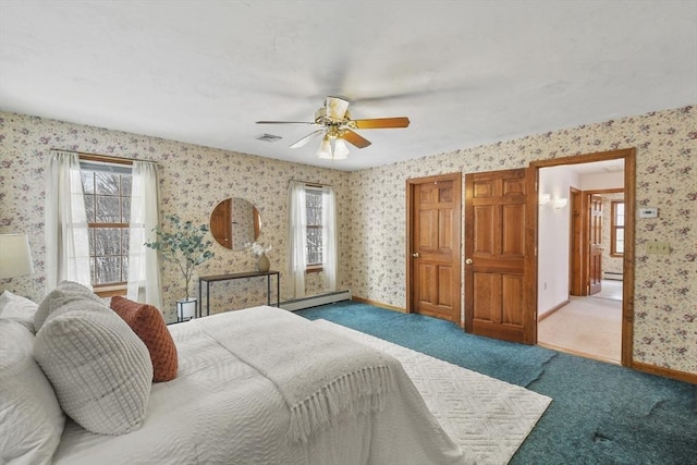 carpeted bedroom featuring multiple windows, ceiling fan, and a baseboard radiator