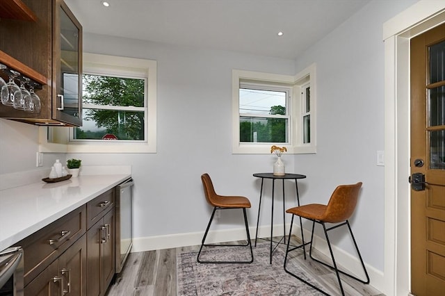 116 Holyoke St, Easthampton, MA 01027 - dining area with light wood-style floors, wine cooler, and recessed lighting