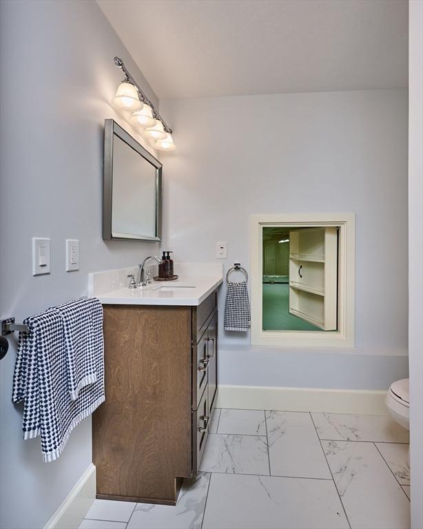 116 Holyoke St, Easthampton, MA 01027 - bathroom with vanity and marble finish flooring