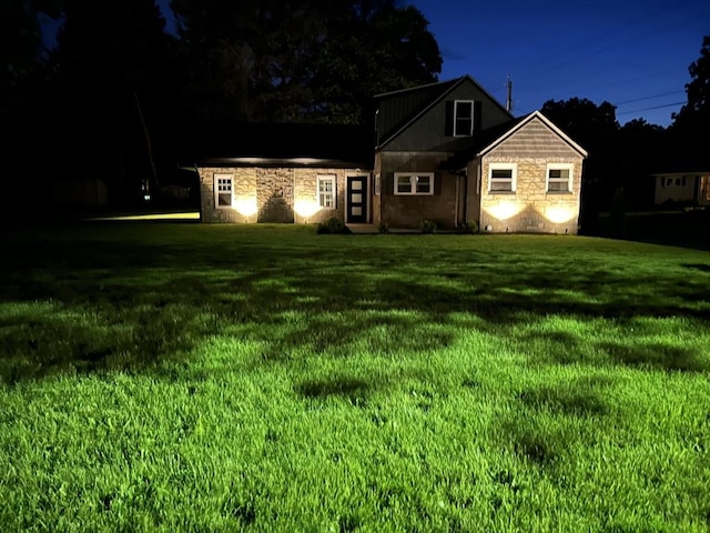 116 Holyoke St, Easthampton, MA 01027 - view of front of house with stone siding and a front yard