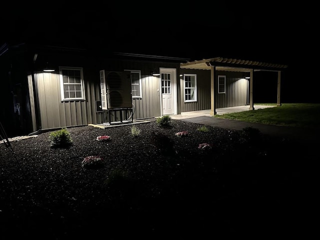 116 Holyoke St, Easthampton, MA 01027 - view of front facade with a pergola, board and batten siding, and a porch
