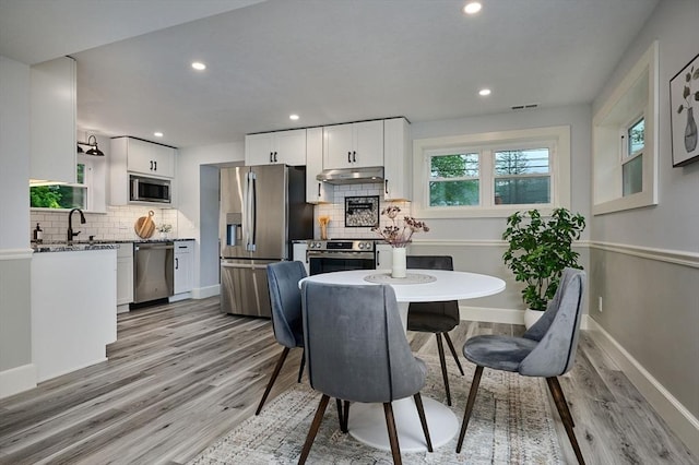 116 Holyoke St, Easthampton, MA 01027 - dining area with light wood-style flooring and recessed lighting