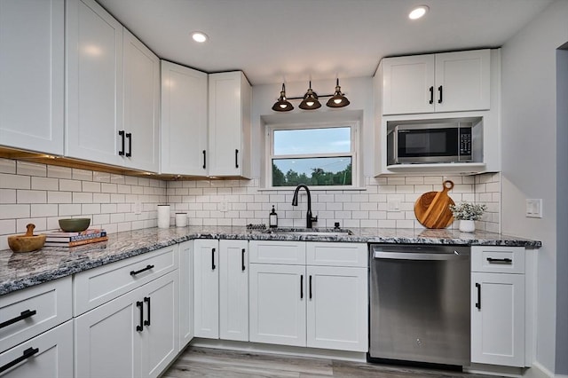 116 Holyoke St, Easthampton, MA 01027 - kitchen with stainless steel appliances, white cabinetry, light wood-style floors, stone countertops, and recessed lighting