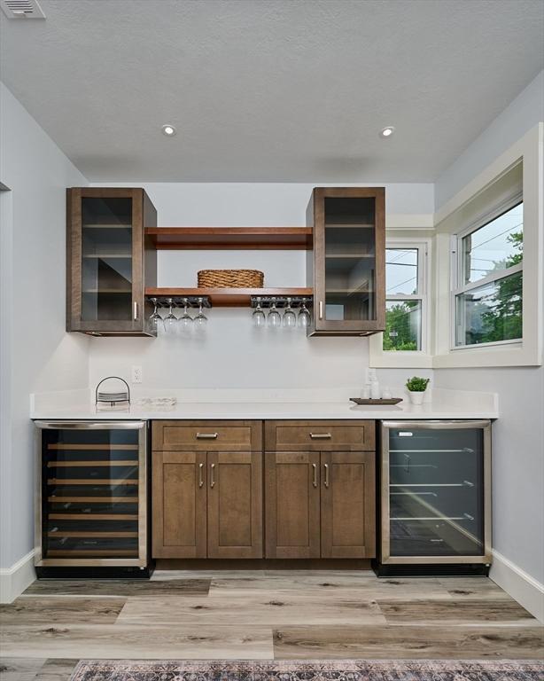 116 Holyoke St, Easthampton, MA 01027 - indoor bar featuring beverage cooler, light wood-type flooring, and recessed lighting