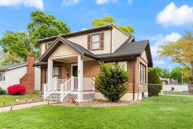 view of front of house with a shingled roof and brick siding