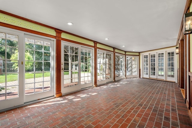 unfurnished sunroom with a healthy amount of sunlight