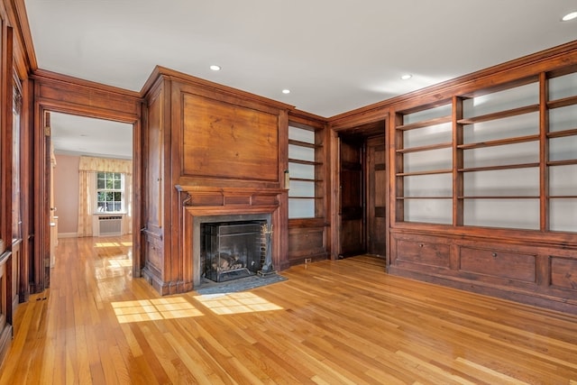 unfurnished living room featuring light hardwood / wood-style floors