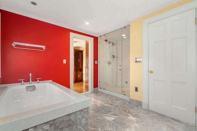 bathroom with separate shower and tub and ornamental molding