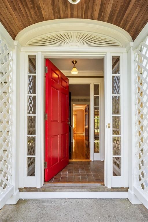 view of exterior entry with a porch