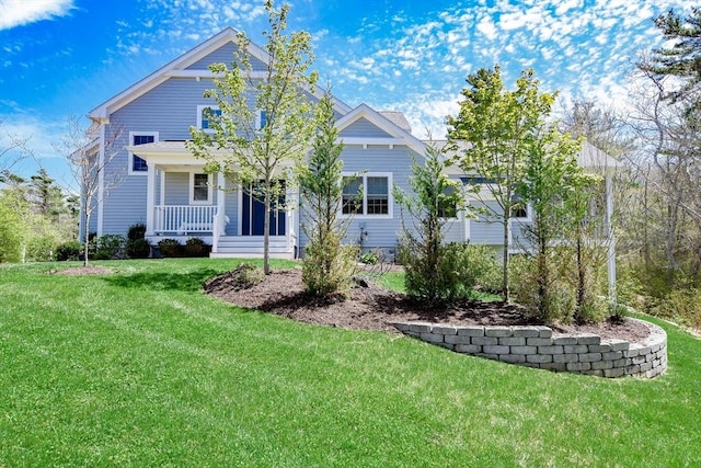 34 Split Rock Ln, Mattapoisett, MA 02739 - view of front of house with covered porch and a front lawn