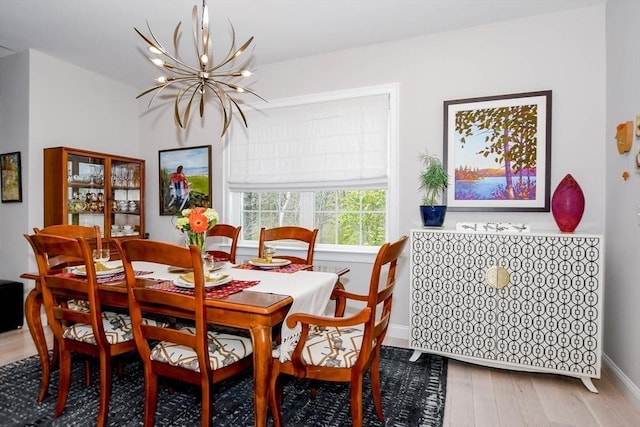 34 Split Rock Ln, Mattapoisett, MA 02739 - dining space featuring a chandelier, wood finished floors, and baseboards