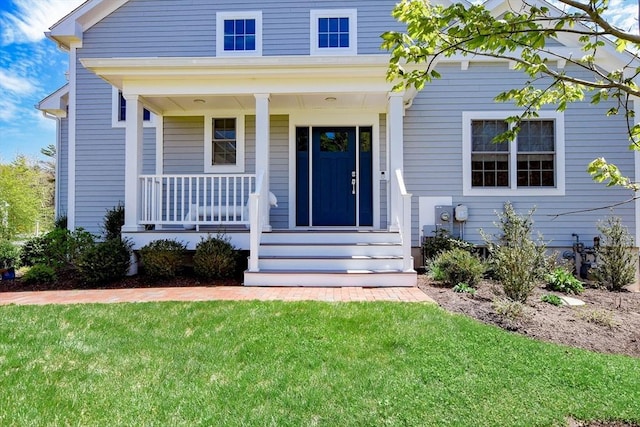 34 Split Rock Ln, Mattapoisett, MA 02739 - view of front facade with a porch and a front lawn