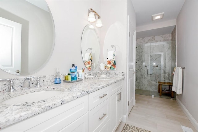 34 Split Rock Ln, Mattapoisett, MA 02739 - full bathroom with a marble finish shower, double vanity, and baseboards