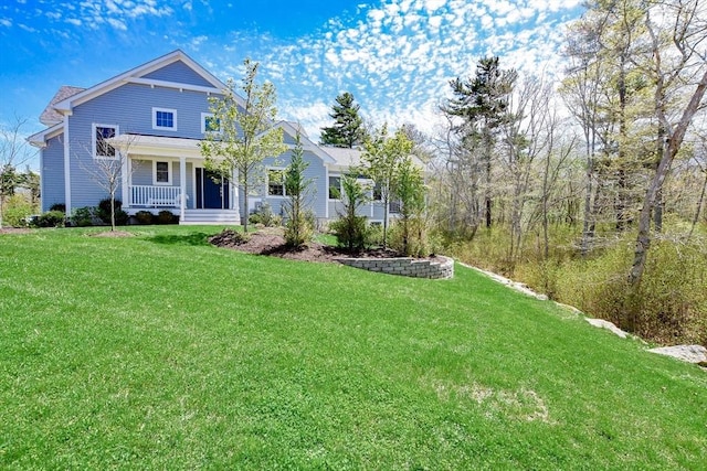 34 Split Rock Ln, Mattapoisett, MA 02739 - view of front facade featuring covered porch and a front lawn