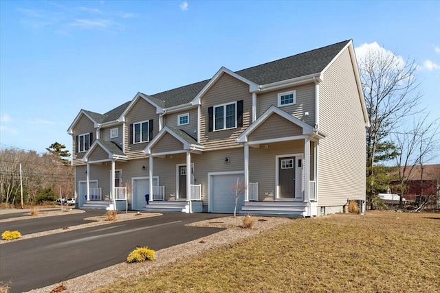 view of front of house with an attached garage and driveway