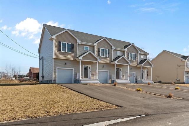 view of front of home with a garage and driveway