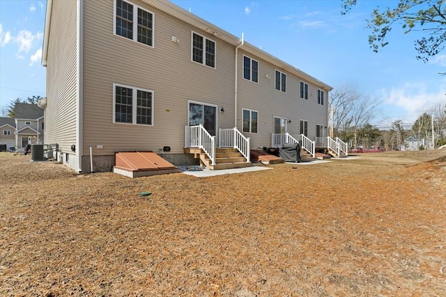 back of property with central air condition unit