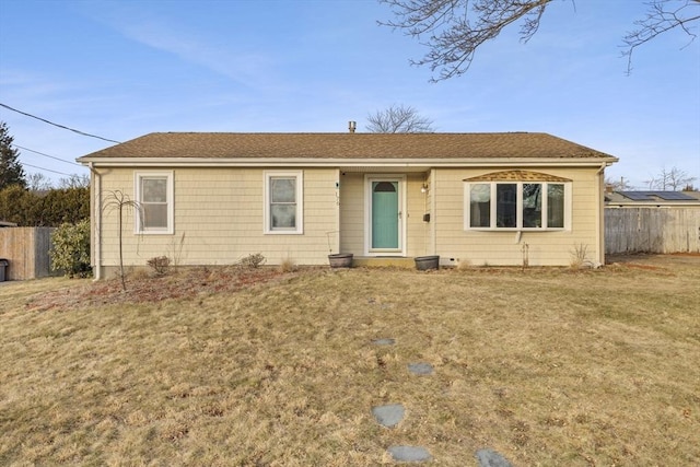 ranch-style home featuring a front yard