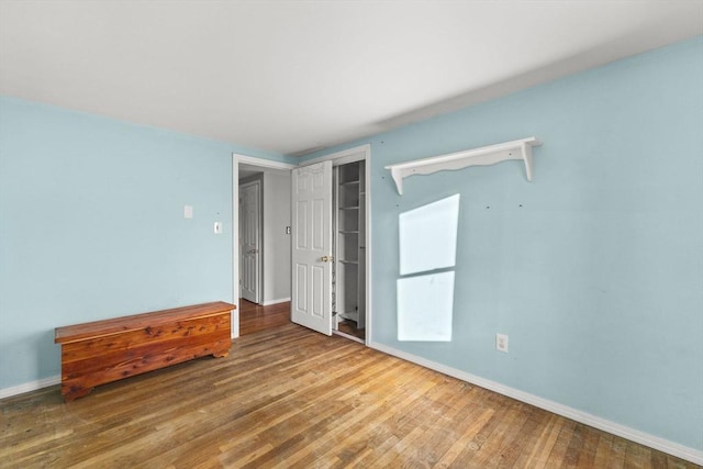 unfurnished bedroom with wood-type flooring