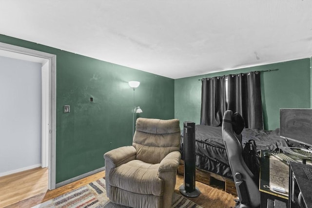 bedroom with wood-type flooring