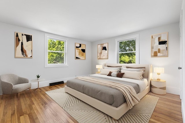 2 Pauls Way, Newbury, MA 01951 - bedroom featuring multiple windows, baseboards, and light wood finished floors