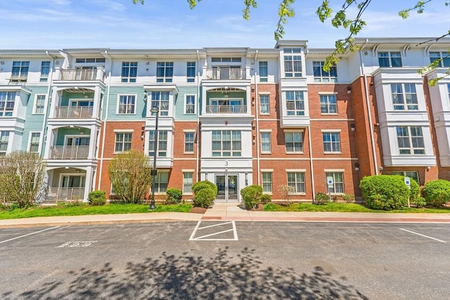 view of property with uncovered parking