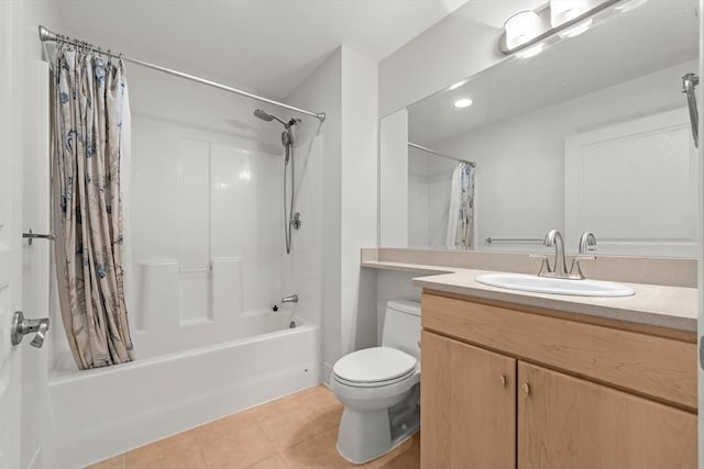 full bath featuring vanity, tile patterned floors, shower / bath combo, and toilet