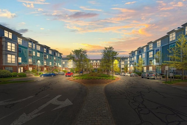 view of street featuring a residential view, sidewalks, and curbs