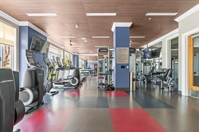 exercise room featuring crown molding