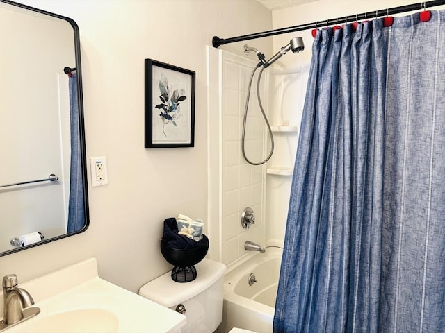 full bathroom with shower / tub combo with curtain, vanity, and toilet