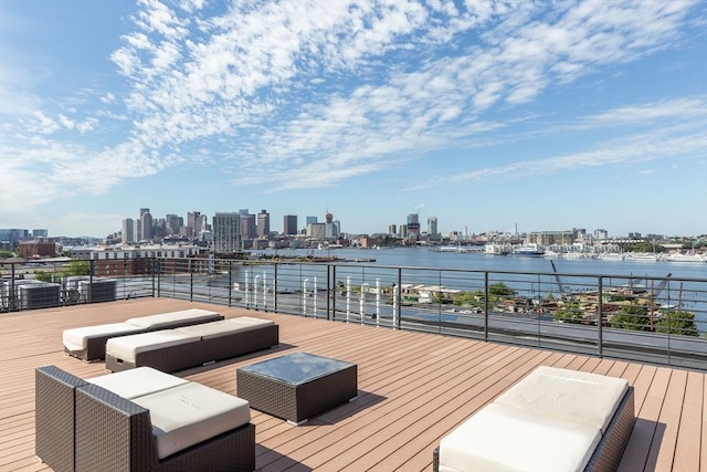 deck with a city view, an outdoor hangout area, and a water view