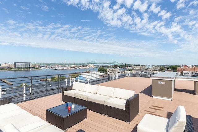 deck featuring outdoor lounge area, a view of city, and a water view