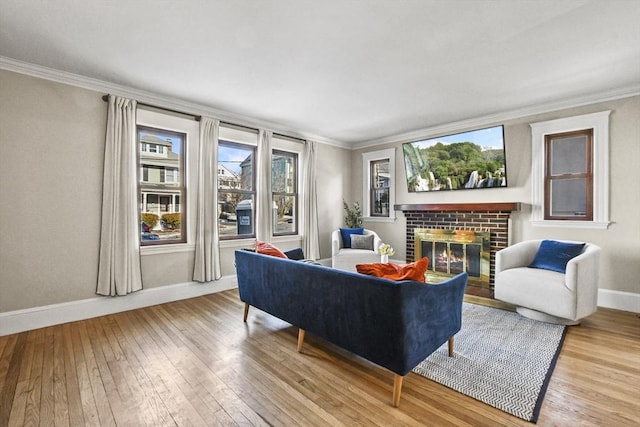 living room with crown molding and light wood-type flooring