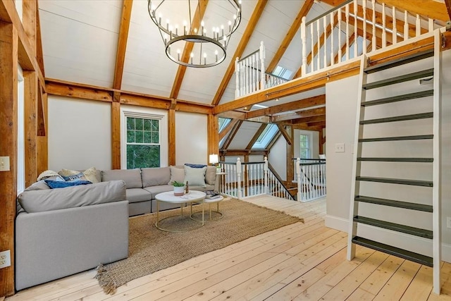 66 S W Dr, Dennis, MA 02638 - living room with a chandelier, hardwood / wood-style floors, beam ceiling, and high vaulted ceiling
