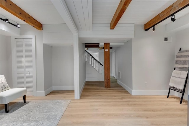 66 S W Dr, Dennis, MA 02638 - living area with beam ceiling, stairway, and light wood-type flooring