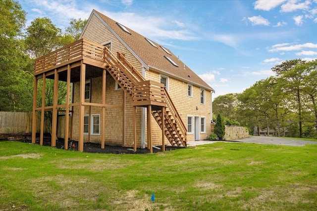 66 S W Dr, Dennis, MA 02638 - back of house with stairway, a wooden deck, and roof with shingles