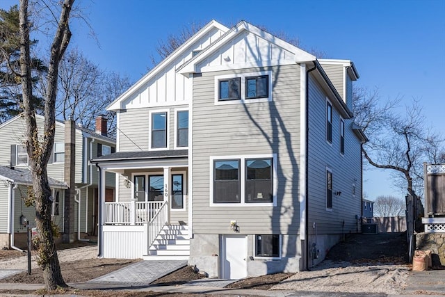 view of front of property with a porch and central air condition unit