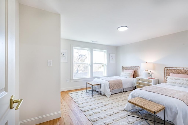 bedroom featuring light hardwood / wood-style floors