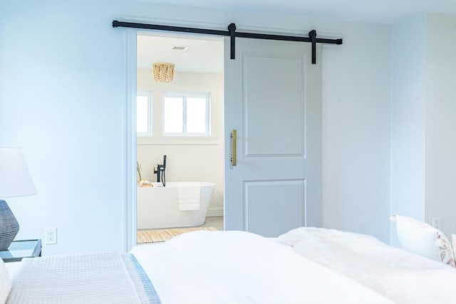 bedroom featuring a barn door