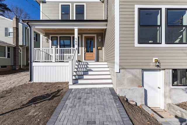 doorway to property with a porch