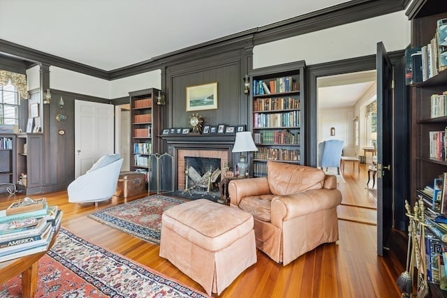 interior space with a healthy amount of sunlight, hardwood / wood-style floors, and crown molding