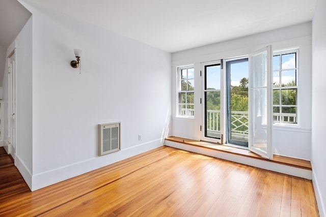 spare room with light wood-type flooring