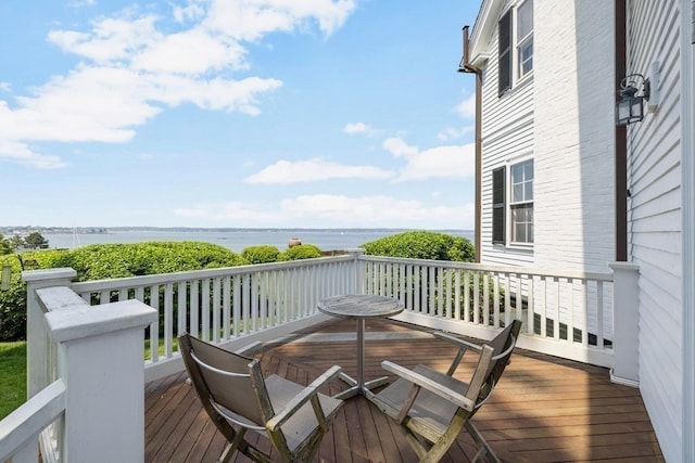 deck featuring a water view