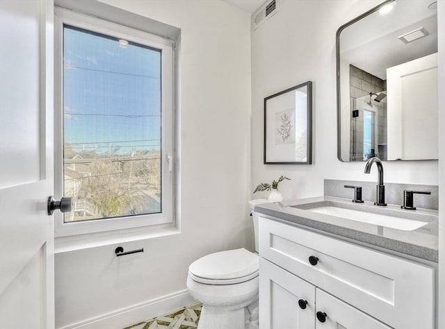 148 Myrtle Unit 1, Melrose, MA 02176 - bathroom with visible vents, toilet, vanity, baseboards, and a shower