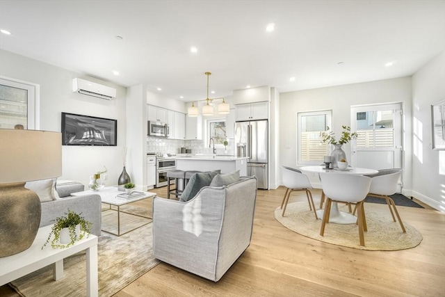 148 Myrtle Unit 1, Melrose, MA 02176 - living area with recessed lighting, light wood-style floors, and a wall unit AC