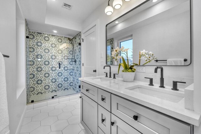 148 Myrtle Unit 1, Melrose, MA 02176 - full bath featuring double vanity, visible vents, a stall shower, and a sink