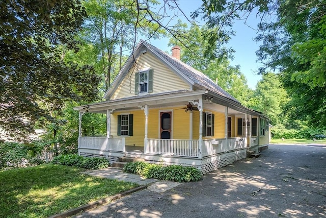 52 Maple St, Belchertown, MA 01007 - farmhouse-style home featuring covered porch and a chimney