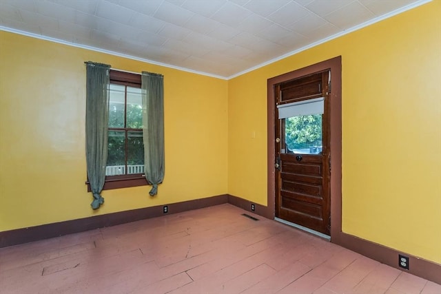 52 Maple St, Belchertown, MA 01007 - foyer with crown molding, healthy amount of natural light, and wood finished floors