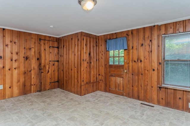 52 Maple St, Belchertown, MA 01007 - spare room with plenty of natural light, wood walls, and ornamental molding
