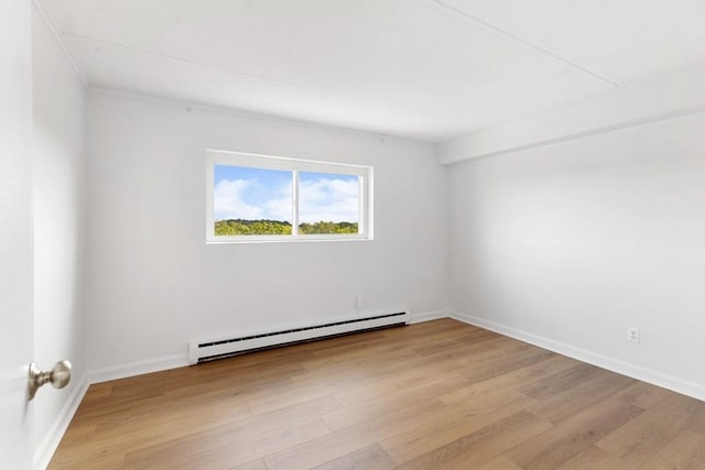 53 Melrose St Unit 7F, Melrose, MA 02176 - unfurnished room featuring baseboard heating, light wood-type flooring, and baseboards